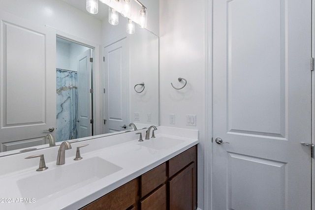 bathroom with vanity and walk in shower