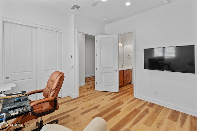 office featuring ceiling fan and light wood-type flooring