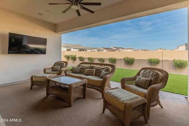 view of patio with an outdoor living space and ceiling fan