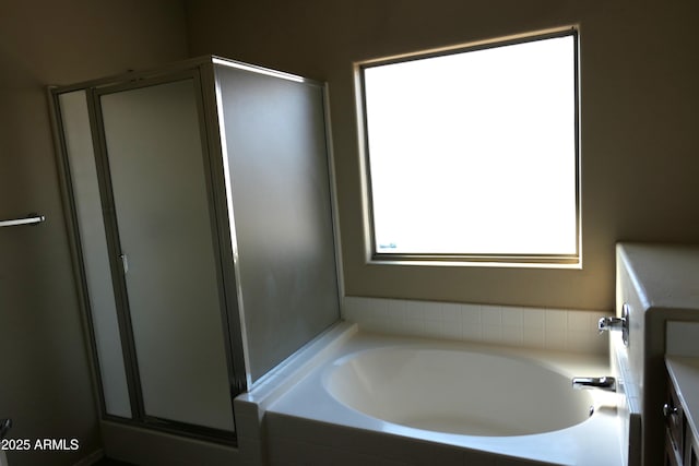 bathroom featuring separate shower and tub and vanity