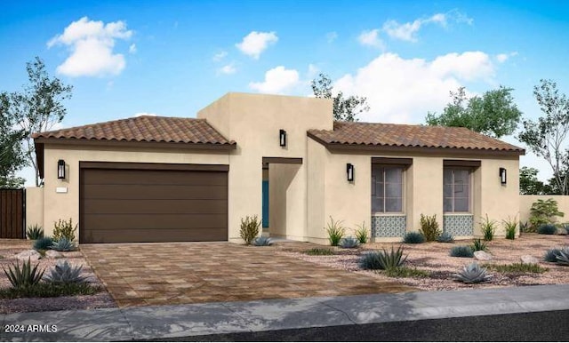 view of front of property featuring fence, a garage, and stucco siding