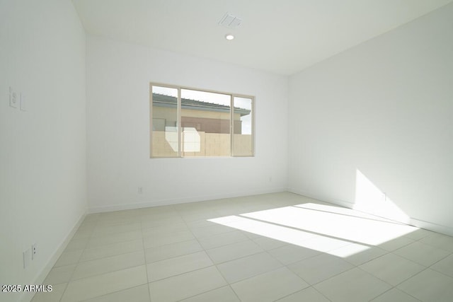 spare room with recessed lighting, light tile patterned flooring, baseboards, and visible vents