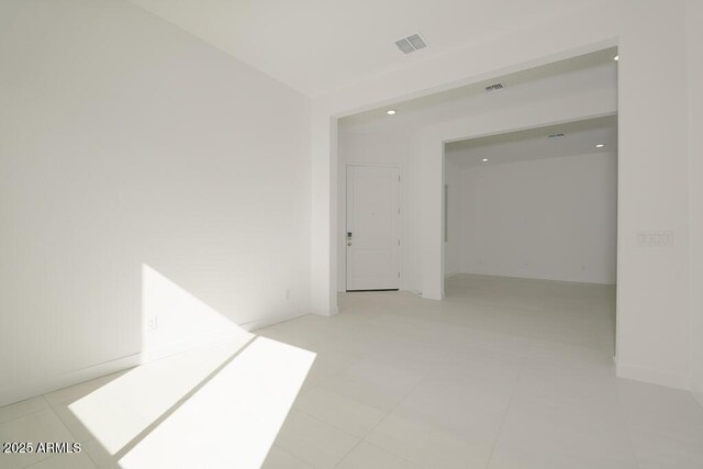 empty room with visible vents and recessed lighting