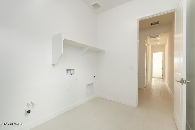 clothes washing area with laundry area, visible vents, gas dryer hookup, and electric dryer hookup