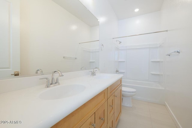 full bath featuring a sink, toilet, double vanity, and tile patterned flooring