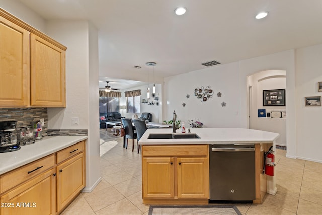 kitchen with pendant lighting, dishwashing machine, sink, tasteful backsplash, and light tile patterned flooring