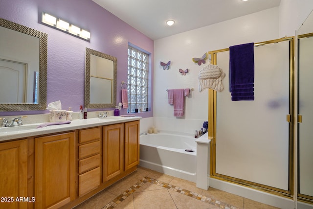 bathroom with tile patterned floors, vanity, and independent shower and bath