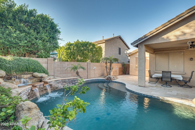 view of pool featuring ceiling fan, a patio area, and pool water feature