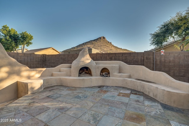 view of patio featuring an outdoor fireplace