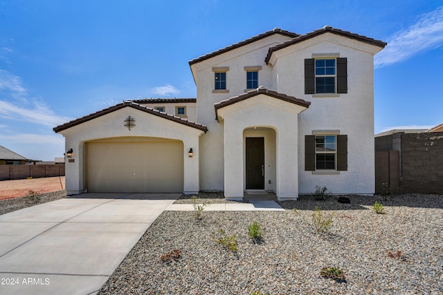 mediterranean / spanish-style home featuring a garage