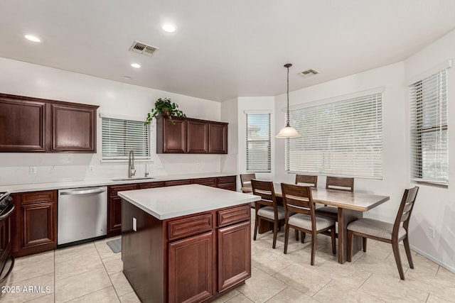 kitchen featuring a sink, visible vents, light countertops, and dishwasher