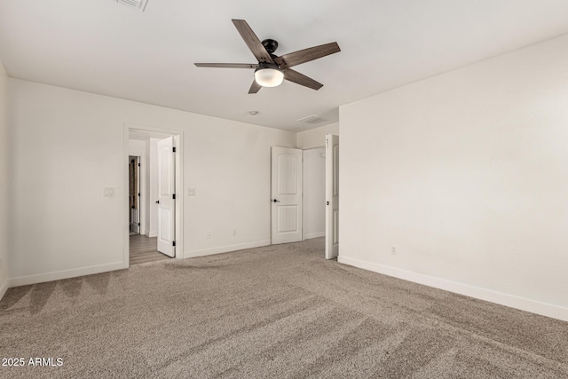 unfurnished bedroom with carpet floors, visible vents, ceiling fan, and baseboards