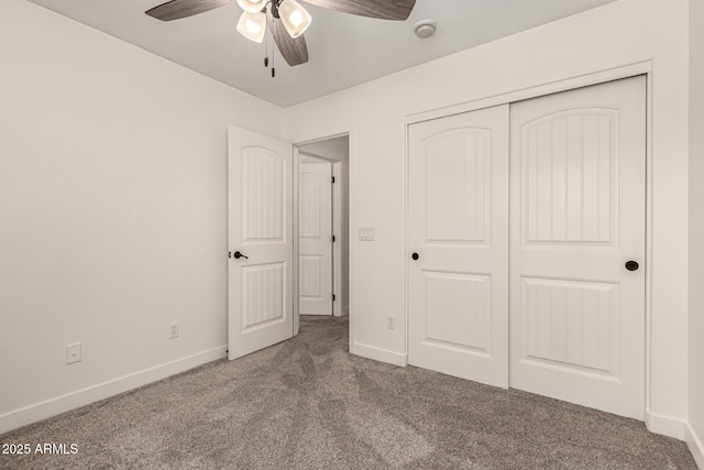 unfurnished bedroom with a ceiling fan, carpet, baseboards, and a closet