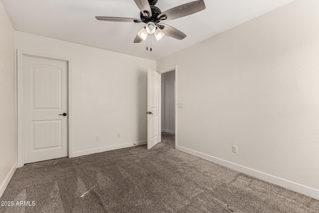 unfurnished bedroom featuring carpet flooring, a ceiling fan, and baseboards