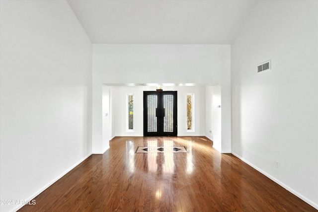 entryway with french doors and hardwood / wood-style flooring