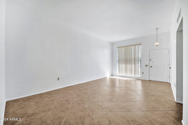 unfurnished room with light tile patterned floors