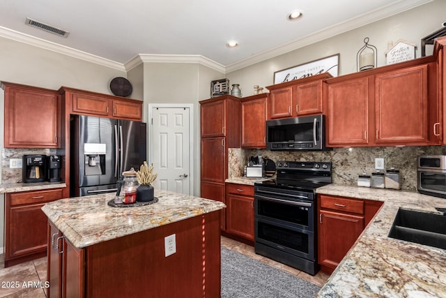 kitchen featuring decorative backsplash, light tile patterned floors, appliances with stainless steel finishes, and light stone countertops