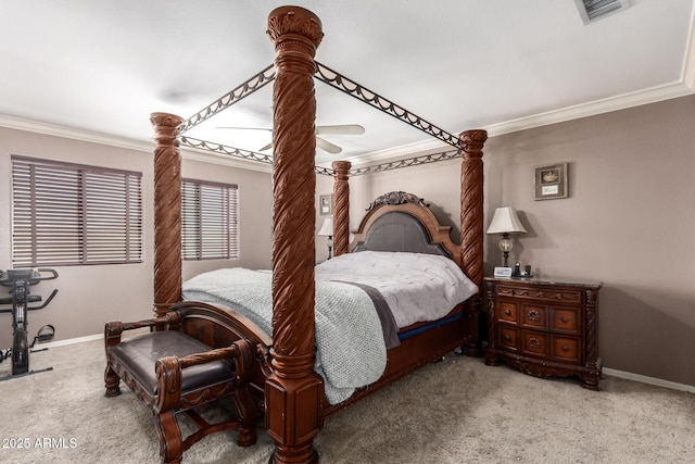 carpeted bedroom featuring ceiling fan and ornamental molding