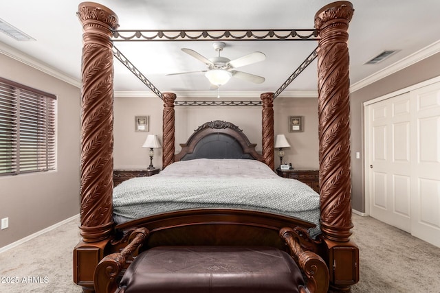 bedroom featuring a closet, ceiling fan, carpet flooring, and ornamental molding