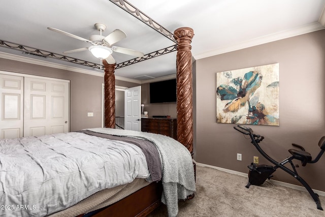 carpeted bedroom featuring a closet, ceiling fan, and crown molding