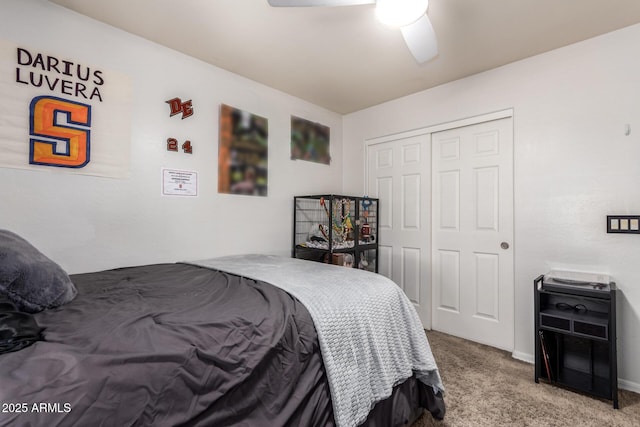 carpeted bedroom featuring a closet and ceiling fan