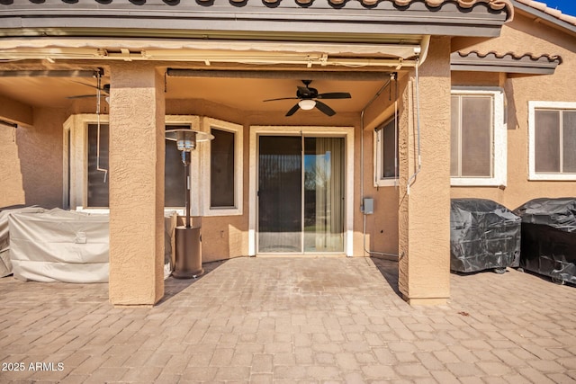 view of patio / terrace with ceiling fan and grilling area