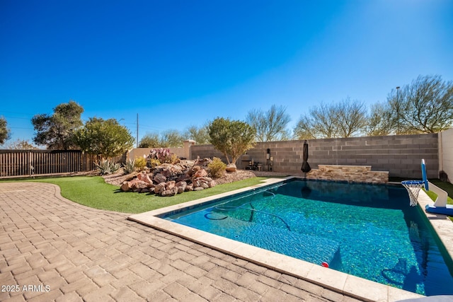 view of pool featuring a patio