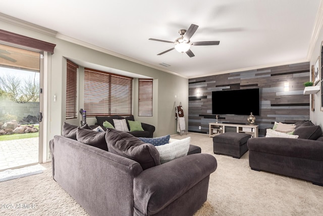 living room with light colored carpet, wooden walls, and ornamental molding