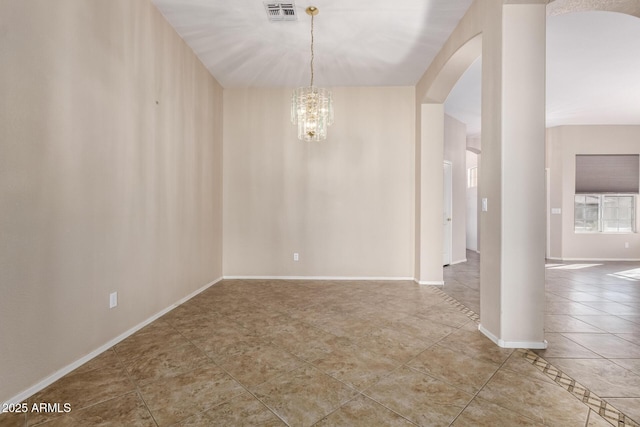 tiled spare room featuring visible vents, baseboards, arched walkways, and a chandelier