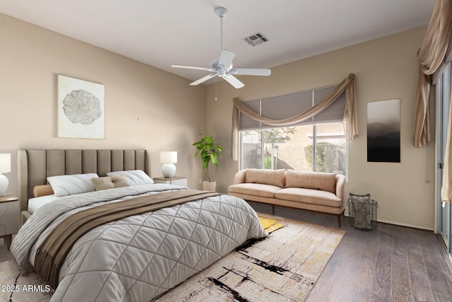 bedroom featuring visible vents, wood finished floors, and a ceiling fan