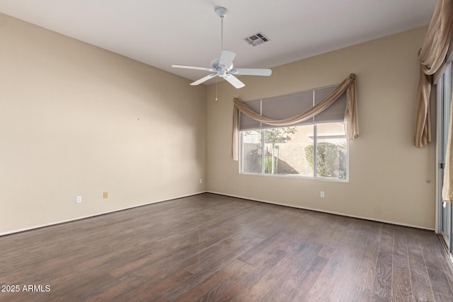 unfurnished room featuring wood finished floors, visible vents, and ceiling fan