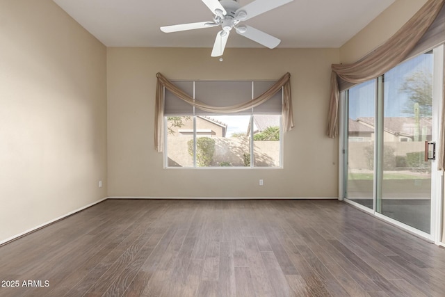 empty room featuring wood finished floors and ceiling fan