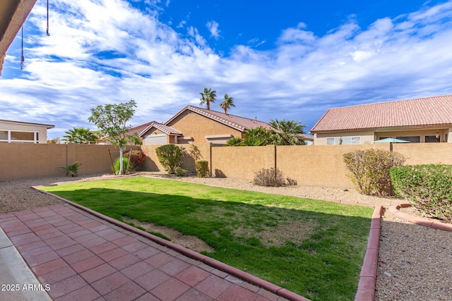 view of yard featuring a fenced backyard