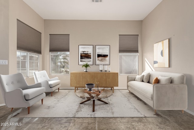 living room featuring visible vents and baseboards