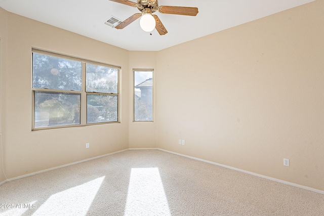 spare room with carpet flooring and ceiling fan