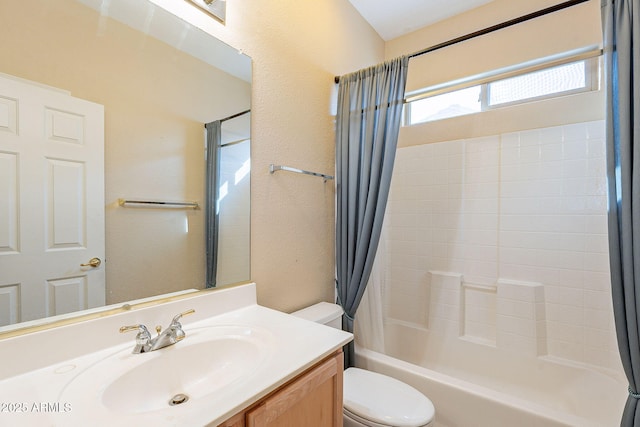 full bathroom with shower / tub combo, vanity, and toilet