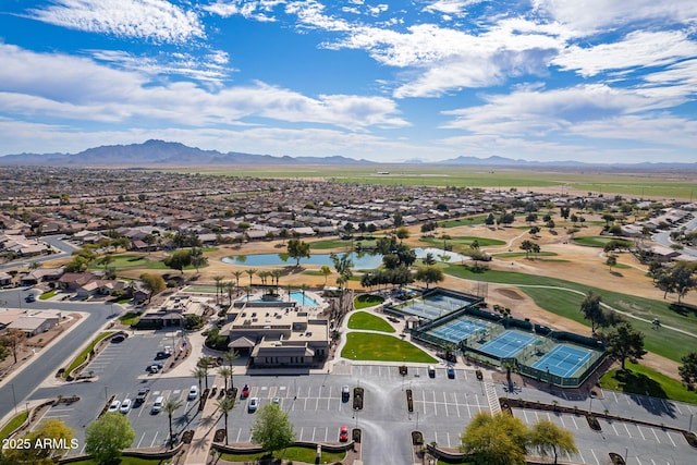 drone / aerial view featuring a water and mountain view