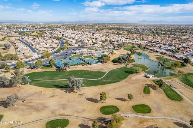 birds eye view of property with a water and mountain view