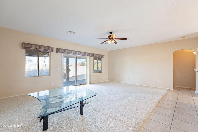 carpeted empty room with ceiling fan