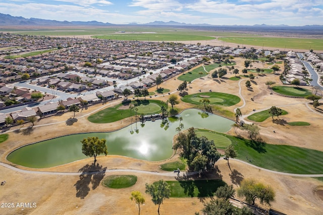 aerial view featuring a water and mountain view