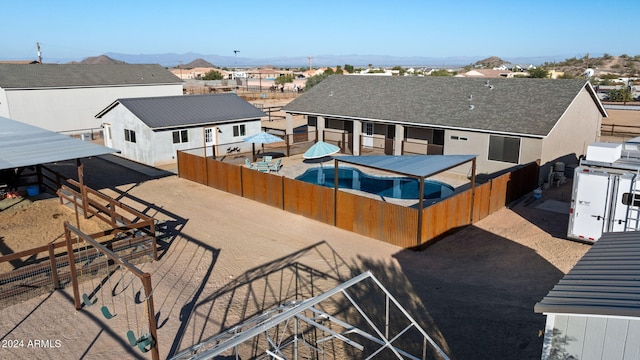 birds eye view of property with a mountain view