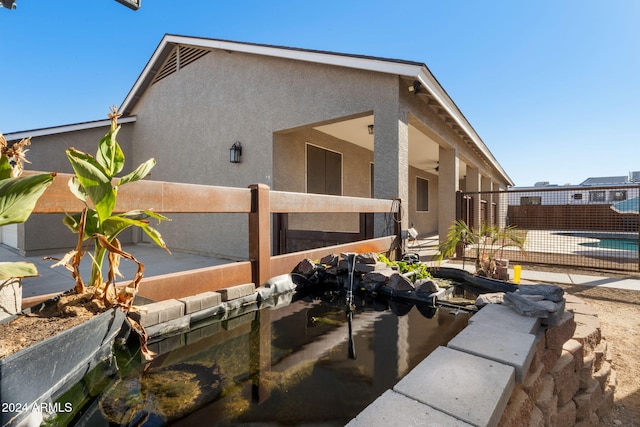 view of side of property with a patio area