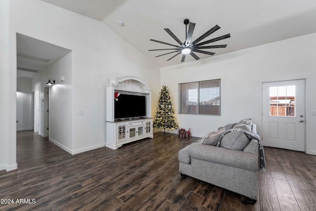 living room featuring lofted ceiling, ceiling fan, and dark wood-type flooring