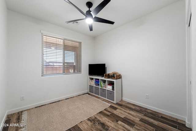 interior space with dark hardwood / wood-style flooring and ceiling fan