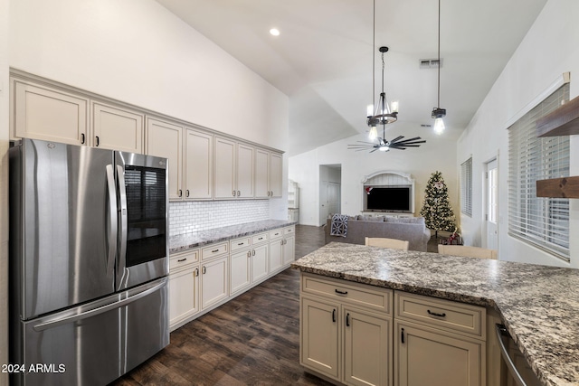 kitchen featuring stainless steel fridge, hanging light fixtures, dark hardwood / wood-style floors, and cream cabinetry