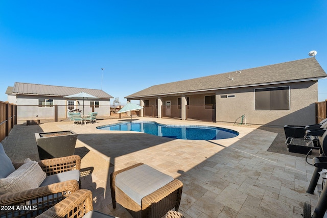 view of swimming pool with a patio