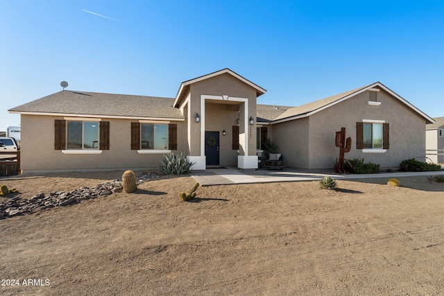 ranch-style home with a patio