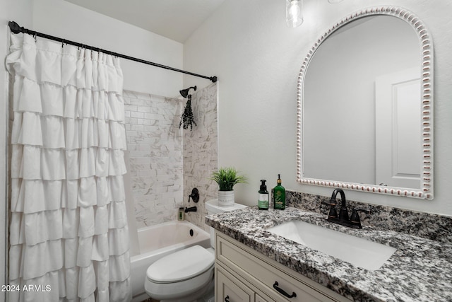 full bathroom with vanity, toilet, and shower / tub combo with curtain