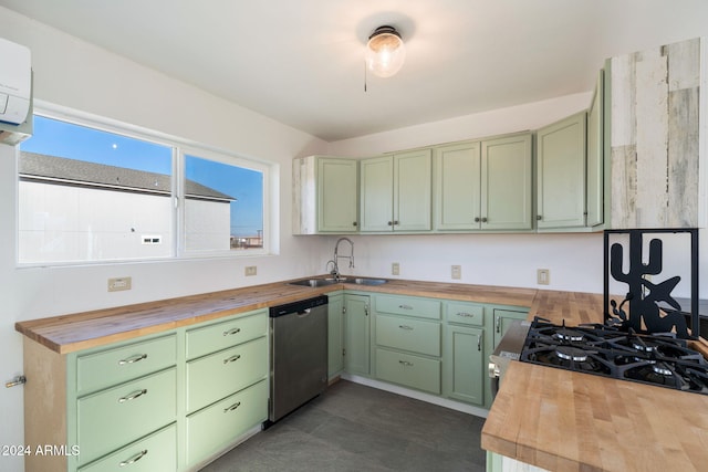 kitchen featuring butcher block countertops, dishwasher, sink, and green cabinetry