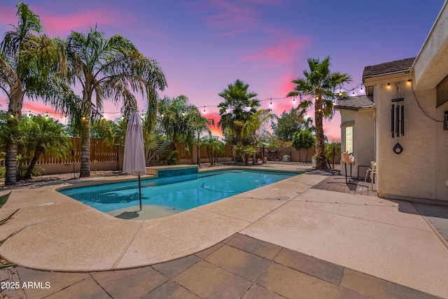 view of swimming pool with a patio and a fenced backyard